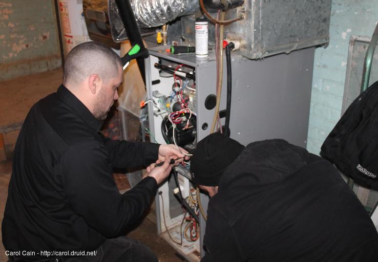 The guys working on our furnace.