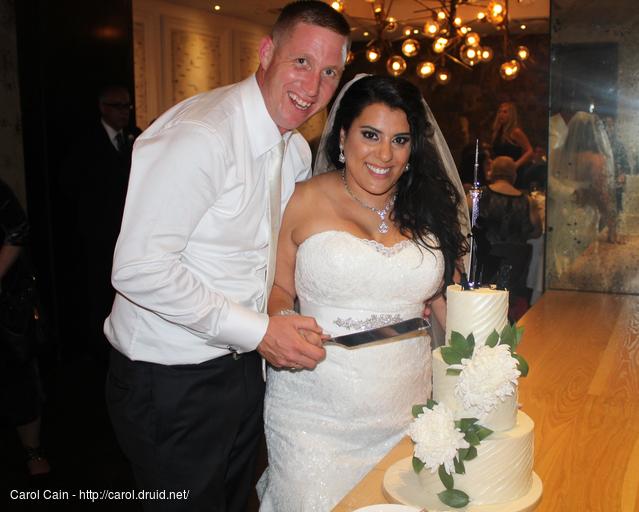 Christopher and Christine cut the cake