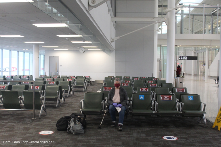 Carol waiting to board the plane